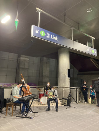 band performs music in station mezzanine